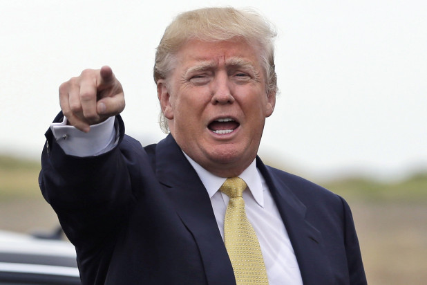 Republican presidential candidate Donald Trump arrives at a fundraising event at a golf course in the Bronx borough of New York, Monday, July 6, 2015. (AP Photo/Seth Wenig)