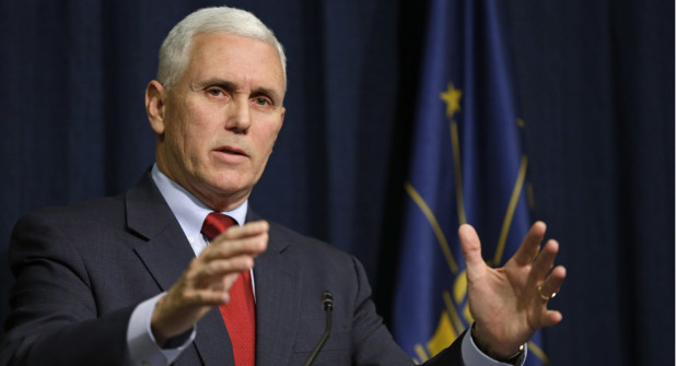 Indiana Gov. Mike Pence announces that he has signed an executive order to shorten the ISTEP+ exam to lessen the burden on students, their parents and teachers during a press conference at the Statehouse in Indianapolis, Monday, Feb. 9, 2015. (AP Photo/Michael Conroy)