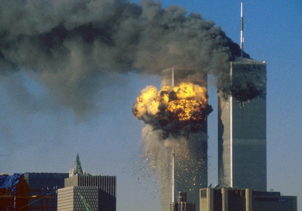 The World Trade Center south tower (L) burst into flames after being struck by hijacked United Airlines Flight 175 as the north tower burns following an earlier attack by a hijacked airliner in New York City September 11, 2001. The stunning aerial assaults on the huge commercial complex where more than 40,000 people worked on an ordinary day were part of a coordinated attack aimed at the nation's financial heart. They destroyed one of America's most dramatic symbols of power and financial strength and left New York reeling. FOURTH OF SEVEN PHOTOGRAPHS REUTERS/Sean Adair SV - RTRMNRM