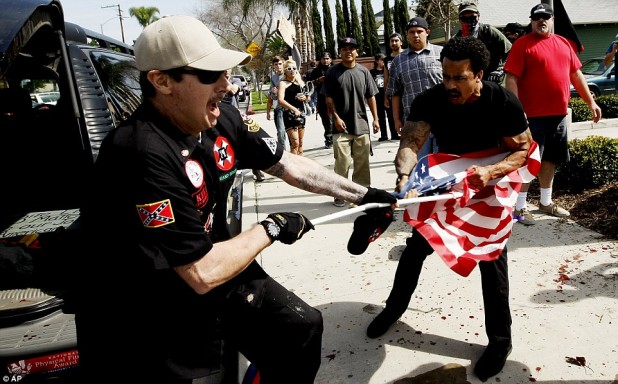 31A15D6000000578-3467467-A_Klansman_and_a_protester_are_seen_above_as_they_fight_for_an_A-a-21_1456620354041