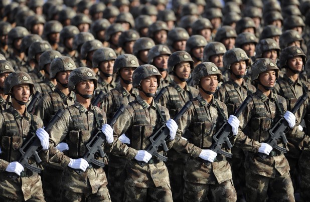 Soldiers from Chinese People's Liberation Army (PLA) Special Operations Forces march in formation during a training session at the 60th National Day Parade Village on the outskirts of Beijing in this September 15, 2009 file photo. China will beef up its military budget by 12.7 percent this year, the government said on March 4, 2011, a return to double-digit spending increases that will stir regional unease. REUTERS/Joe Chan/Files (CHINA - Tags: MILITARY) CHINA OUT. NO COMMERCIAL OR EDITORIAL SALES IN CHINA