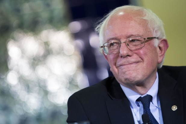 Senator Bernie Sanders, an independent from Vermont and 2016 Democratic presidential candidate, smiles during an interfaith roundtable in Washington, D.C., U.S., on Wednesday, Dec. 16, 2015. Sanders said figures like Trump attempt to "divide" Americans. "A few months ago we're supposed to hate Mexicans and he thinks they're all criminals and rapists and now we're supposed to hate Muslims, and that kind of crap is not going to work in the United States of America," he said. Photographer: Drew Angerer/Bloomberg via Getty Images