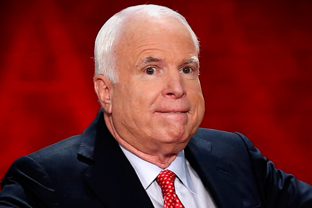 U.S. Senator John McCain gestures as he arrives to address the third session of the Republican National Convention in Tampa