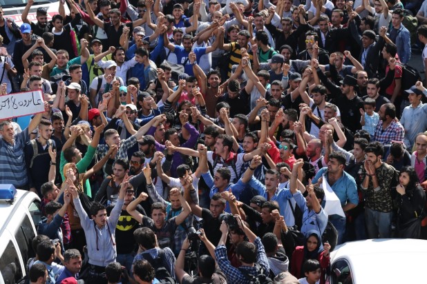 ISTANBUL, TURKEY - SEPTEMBER 15: Syrian refugees, try to get the Istanbul bus terminal to go to Germany through Greece, stage a demonstration in Istanbul, Turkey on September 15, 2015. Isa Terli / Anadolu Agency