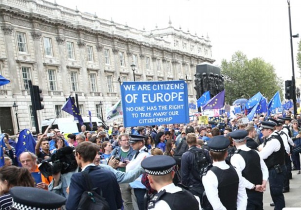 Police officers form a cordon to seperate a pro-Europe anti-Brexit March for Europe (L) from a pro-Brexit demonstration (R) in Parliament Square in central London on September 3, 2016. Thousands marched in central London to Parliament Square in a pro-Europe rally against the referendum vote to leave the European Union. They were met by a smaller static counter-protest of those in favour of Brexit. / AFP PHOTO / JUSTIN TALLISJUSTIN TALLIS/AFP/Getty Images