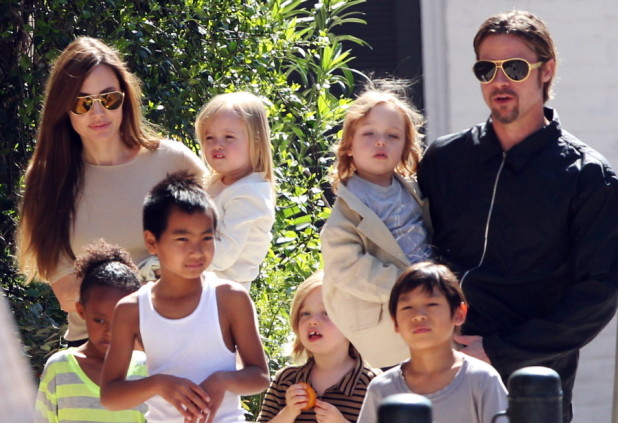 #7011153 The Jolie-Pitt family headed out in New Orleans, Louisiana to do some grocery shopping at a local market on March 20, 2011. Angelina has brought all six children to visit their dad Brad Pitt while he works on his latest project "Cogan's Trade". Maddox, Pax, Zahara and Shiloh walked while the twins Knox and Vivienne hitched a ride from mom and dad who were all smiles while out and about on a lovely sunny day. Brad and Angelina waved to fans as they strolled the street to and from the market.   Fame Pictures, Inc - Santa Monica, CA, USA - +1 (310) 395-0500