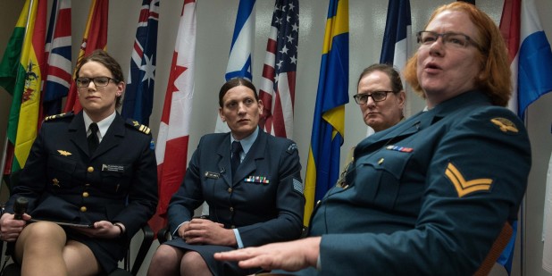 (From L to R), transgenders Major Alexandra Larsson of the Swedish Armed Forces, Sergeant Lucy Jordan of the New Zealand Air Force and Major Donna Harding of the Royal Australian Army Nursing Corps listen to Corporal Natalie Murray of the Canadian Forces speak during a a conference entitled "Perspectives on Transgender Military Service from Around the Globe" organized by the American Civil Liberties Union (ACLU) and the Palm Center in Washington,DC on October 20, 2014. AFP PHOTO/Nicholas KAMM (Photo credit should read NICHOLAS KAMM/AFP/Getty Images)