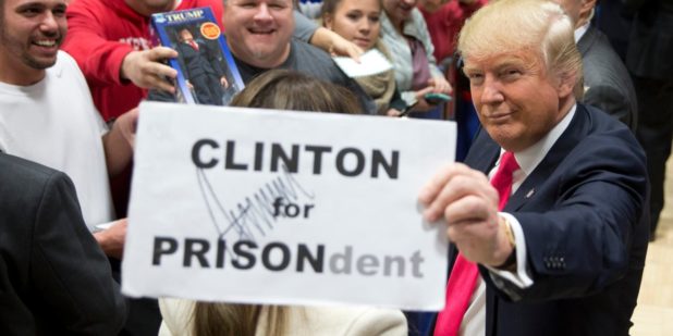 3-photos-of-donald-trump-holding-up-a-hillary-clinton-for-prison-sign