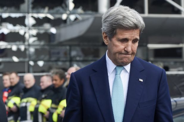 US Secretary of State John Kerry attends a ceremony at the Brussels National Airport to pay tribute to the victims of the terrorist attacks on March 25, 2016 in Zaventem. Kerry declared "Je suis Bruxellois" -- "I am a citizen of Brussels" -- in support for the people of the Belgian capital, echoing their backing for the United States after the 9/11 terror attacks. Triple bomb attacks in Brussels on March 22, 2016 left 31 people dead and 300 injured. / AFP / BELGA / FREDERIC SIERAKOWSKI / Belgium OUT