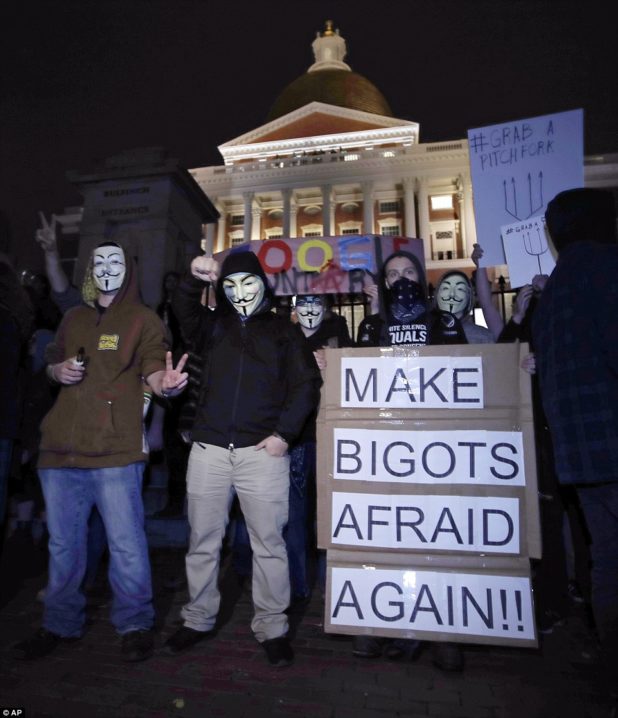 3a37810900000578-3922098-boston_protesters_wearing_the_v_for_vendetta_masks_associated_wi-a-39_1478778493572