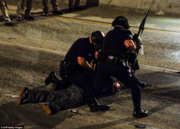 3a3b29e900000578-3922098-los_angeles_a_demonstrator_was_handcuffed_and_arrested_by_police-a-6_1478776851419