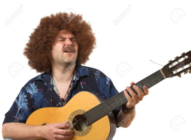 389021-hippie-playing-his-guitar-stock-photo