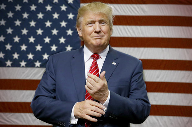 Republican presidential candidate Donald Trump speaks to supporters as he takes the stage for a campaign event in Dallas, Monday, Sept. 14, 2015. (AP Photo/LM Otero)