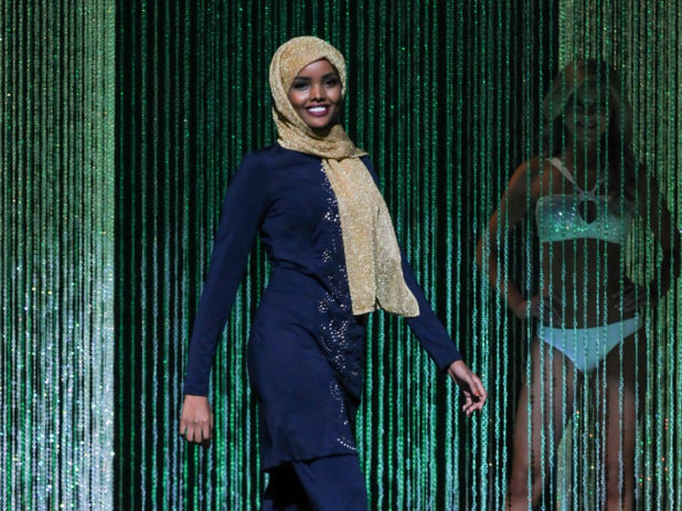 Halima Aden wore a navy blue, embroidered burkini — a full-body bathing suit — during the swimsuit competit