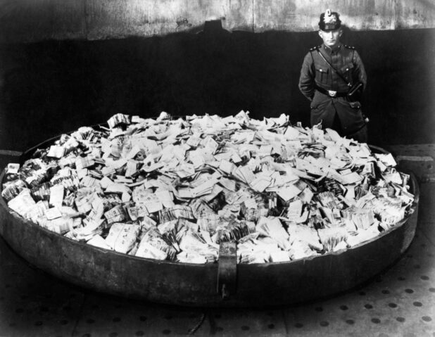 Worthless banknotes are collected to be burned. 1923.