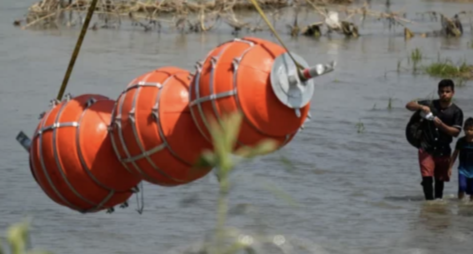 Invaders Pictured Walking Past Floaty Toys as They are Being Installed in the Rio Grande